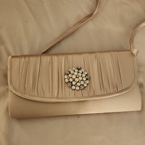 Elegant Cream Clutch with Pearl Accent